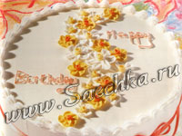 Торт с сахарными цветами и лентами